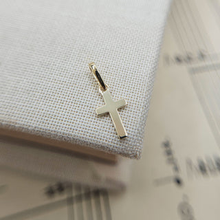 micro cross charm in solid 9ct gold