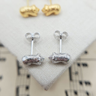 solid silver earrings modelled as guinea pugs