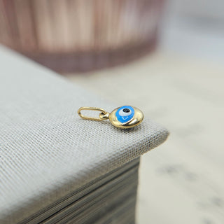 9k gold and enamel evil eye charm