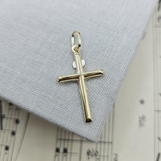 reverse of dainty gold crucifix