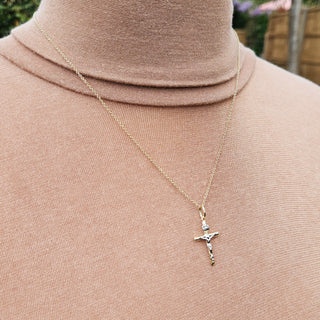 small gold crucifix and chain