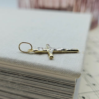 side profile of yellow gold gold crucifix pendant