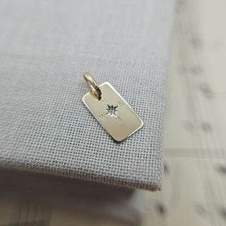 gold compass tag charm