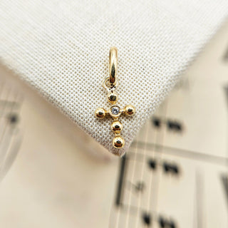 tiny 9ct gold cross charm with cz