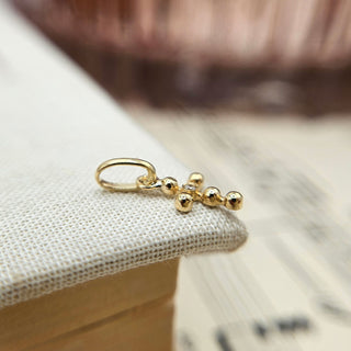 micro gold cross charm with bobble texture