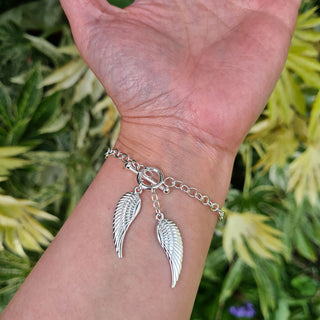 women's angel ring bracelet on wrist