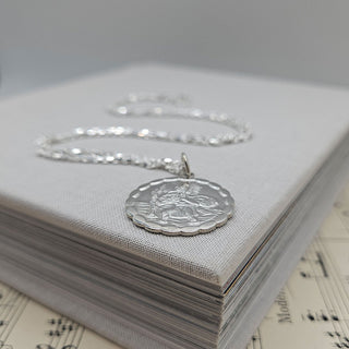 scalloped detailing on large St Christopher medal pendant