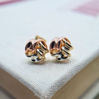 close up of knot studs made from 9ct gold