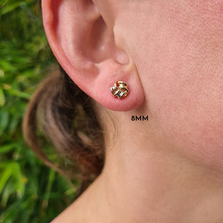 8mm know studs in ladies ear
