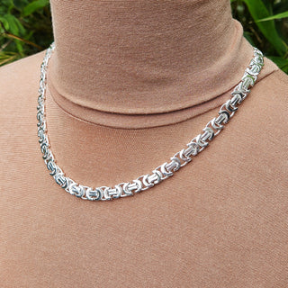 another view of silver byzantine chain on neck
