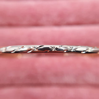 close up of diamond cut pattern on ladies bangle
