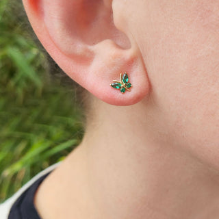 small butterfly earrings being worn