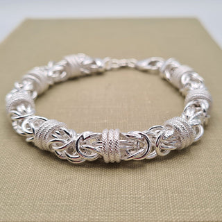 close up of byzantine links on silver bracelet
