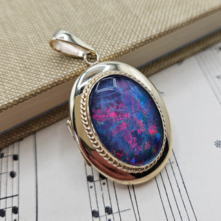 Close up of the black opal triplet set into the solid gold locket