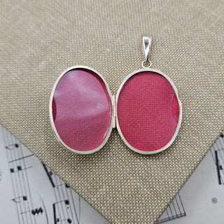 The photo locket has space inside for 2 photos of loved ones.