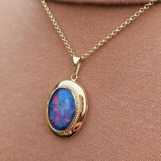 solid 9K gold locket with black opal