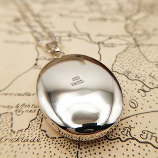 reverse of the locket with British hallmarks
