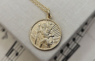 the symbolism of st christopher pendants