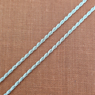 925 sterling silver rope chain necklace displayed in on orange fabric