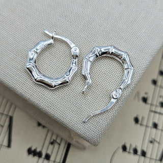 secure lever back setting on silver creole earrings