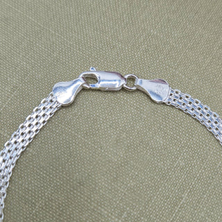 Women's 7.5 inch sterling silver Bismark chain bracelet laid flat showing intricate interlocking links