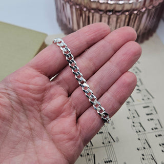 8.5 inc bracelet in hand for scale