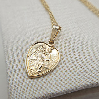 close up of 9ct gold heart st christopher