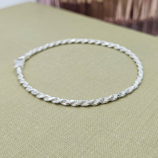 close up of woven rope links on ladies silver bracelet