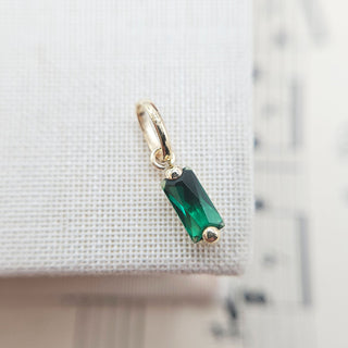 green cz baguette shaped charm