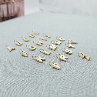 initial pendants made from solid gold