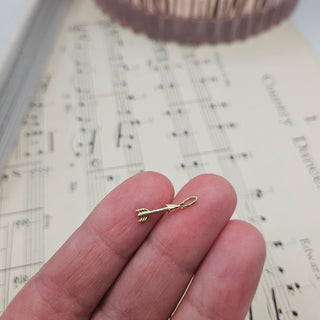 gold arrow in  hand for scale
