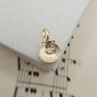 solid gold shell charm with cz