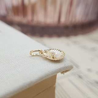 side profile of gold shell charm