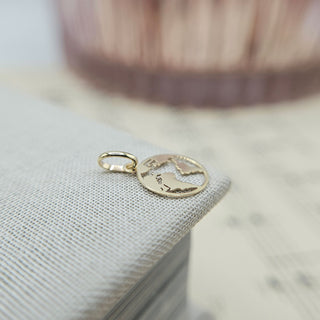 dainty world charm in gold