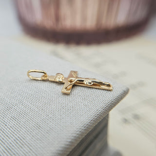 side profile of solid gold crucifix pendant