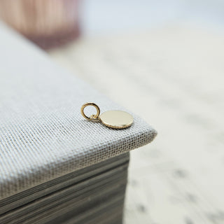 flat disc charm made from solid 9ct yellow gold