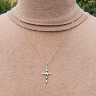 small lightweight crucifix pendant necklace in yellow and white gold