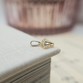 diamond-shaped charm with sparkling cubic zirconia stone