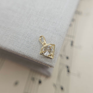 dainty diamond-shaped gold charm