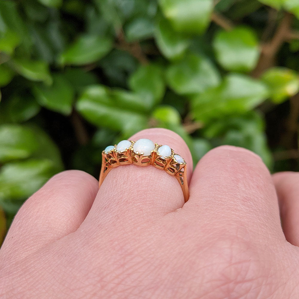 another view of 18ct opal ring on finger