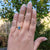 pear sapphire ring on woman's hand