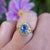 close up of sapphire ring on hand