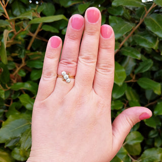 diamond trilogy ring on hand