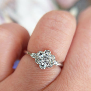 close up of old cut diamonds in platinum flower ring