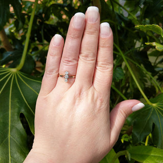 antique diamond trilogy ring on ladies hand