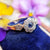 sapphire and diamond flower in it's antique case