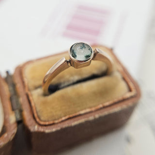 close up of moss agate stone in vintage solitaire ring