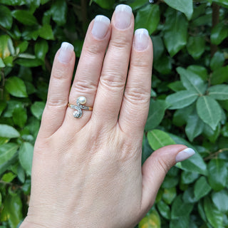 antique 18k gold diamond and pearl ring on hand