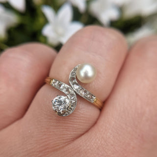 diamond and pearl 18ct gold ring on hand
