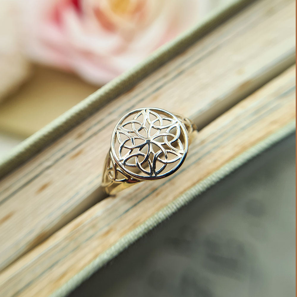 intricately designed face on ladies gold ring